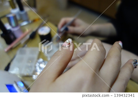 Nail Art Detail with Pearl Accent and Tools Nail Art Detail with Pearl Accent and Tools 139432341