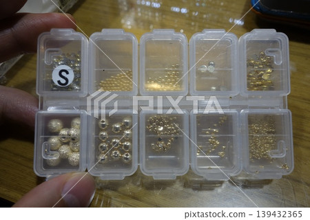 Jewelry Bead Organizer with Gold and Silver Beads Jewelry Bead Organizer with Gold and Silver Beads 139432365