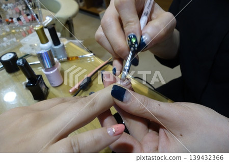 Nail Technician Applying Gel Polish to Client's Fingernails Nail Technician Applying Gel Polish to Client's Fingernails 139432366