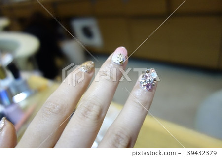 Close-up of Decorated Nails with Glitter and Rhinestones Close-up of Decorated Nails with Glitter and Rhinestones 139432379