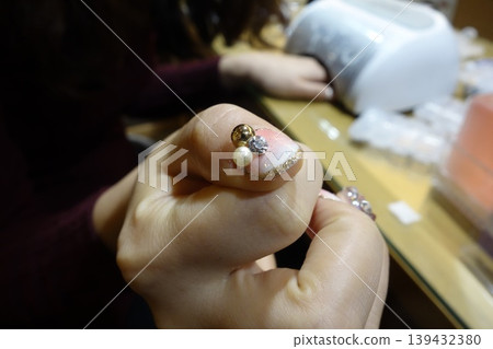 Close-up of Intricate Nail Art with Gemstone Accents Close-up of Intricate Nail Art with Gemstone Accents 139432380