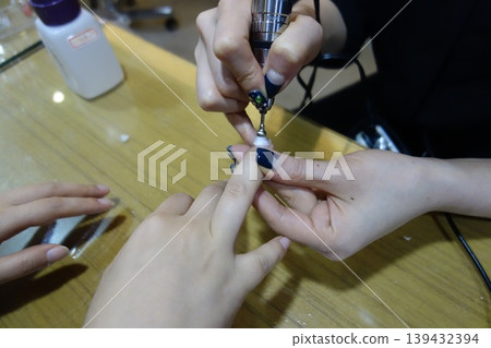 Nail Technician Applying Gel Polish Nail Technician Applying Gel Polish 139432394