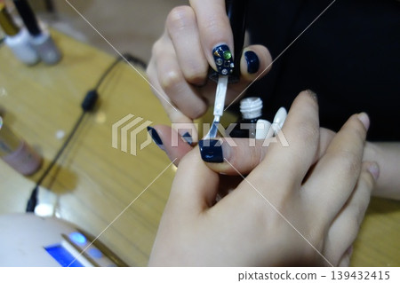 Nail Artistry: Detailed Nail Polish Application Close-up Nail Artistry: Detailed Nail Polish Application Close-up 139432415
