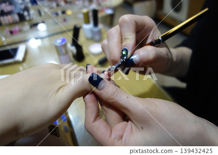 Nail Artist Creating Decorative Nail Art Nail Artist Creating Decorative Nail Art 139432425