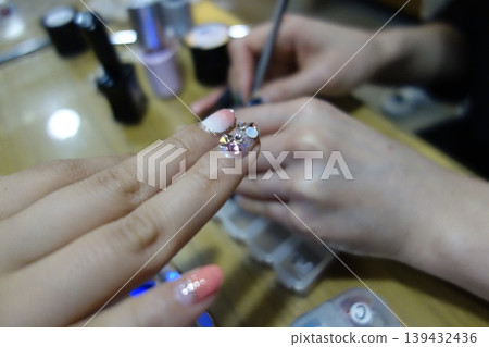 Nail Art Detail with Sparkling Decorations Nail Art Detail with Sparkling Decorations 139432436
