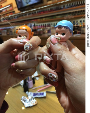 Nail Art with Miniature Dolls in Salon Setting 139432441