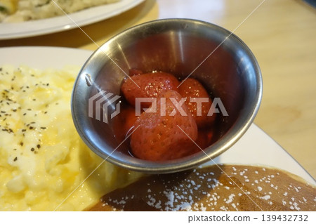 Strawberries in Metal Bowl with Scrambled Eggs and Pancake Strawberries in Metal Bowl with Scrambled Eggs and Pancake 139432732