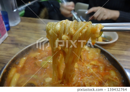 Chopsticks Lifting Spicy Noodles from Pot Chopsticks Lifting Spicy Noodles from Pot 139432764