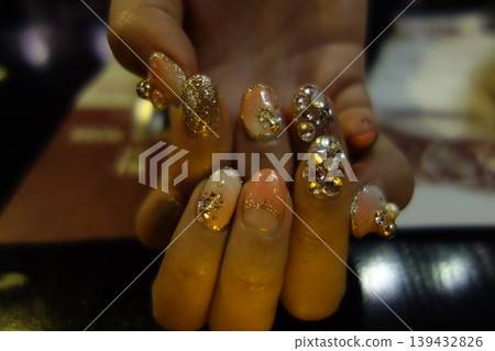Gleaming Gold and Crystal Nail Art Close-up Gleaming Gold and Crystal Nail Art Close-up 139432826