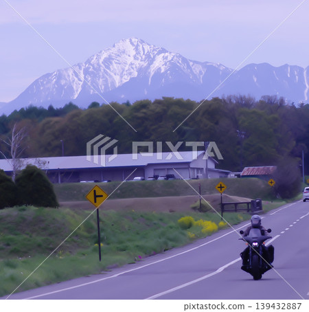 Motorcycles riding with the Yatsugatake Mountains in the background 139432887
