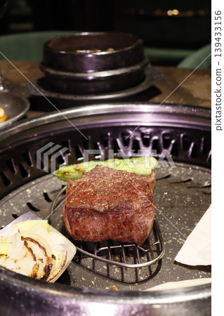 Grilled Steak with Onions on Charcoal Grill Grilled Steak with Onions on Charcoal Grill 139433156