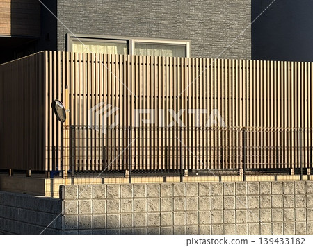 Vertical lattice louvered privacy fence for detached houses (brown/wood grain color) 139433182