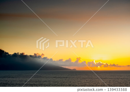 Sunset view of Kuchinoerabu Island from Yakushima (Summer) Sunset view of Kuchinoerabu Island from Yakushima (Summer) 139433388