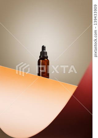 Amber serum dropper bottle on warm set 139433909