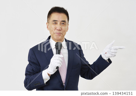 A senior election candidate points to the right against a white background. A senior election candidate points to the right against a white background. 139434151
