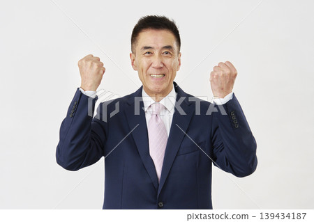 Senior businessman fist pumping white background Senior businessman fist pumping white background 139434187