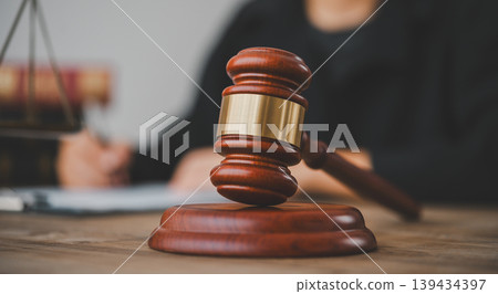 Law theme, mallet of the judge, law enforcement officers, evidence-based cases, and documents taken into account. 139434397