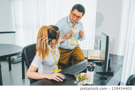 Young female employee seducing boss or supervisor at work Make your boss uncomfortable and afraid of sexual abuse. Concept of sexual harassment in the workplace Young female employee seducing boss or supervisor at work Make your boss uncomfortable and afraid of sexual abuse. Concept of sexual harassment in the workplace 139434403