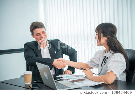 Business people shaking hands business etiquette congratulation merger and acquisition concepts Business people shaking hands business etiquette congratulation merger and acquisition concepts 139434409