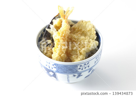 Tempura rice bowl photographed alone against a white background. Tempura rice bowl photographed alone against a white background. 139434873
