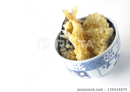 Tempura rice bowl photographed alone against a white background. Tempura rice bowl photographed alone against a white background. 139434879