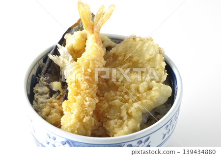 Tempura rice bowl photographed alone against a white background. Tempura rice bowl photographed alone against a white background. 139434880