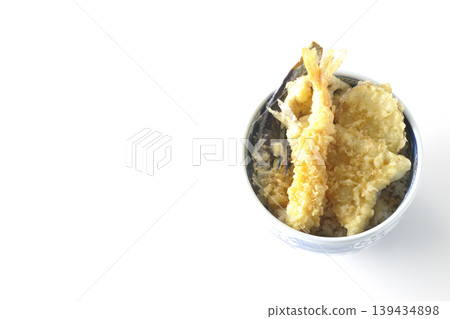 Tempura rice bowl photographed alone against a white background. Tempura rice bowl photographed alone against a white background. 139434898