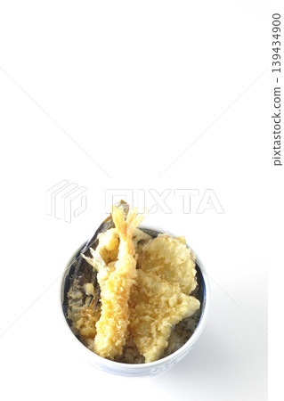 Tempura rice bowl photographed alone against a white background. Tempura rice bowl photographed alone against a white background. 139434900