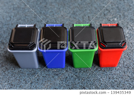 Colorful recycling bins lined up, waste sorting, sustainability 139435349