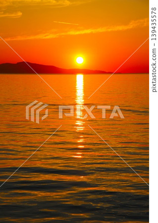 Awaji Island, Toshi Port: A beautiful sunset over the rich ocean. 139435578