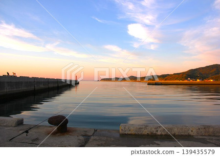 Awaji Island, Toshi Port: A beautiful sunset over the rich ocean. Awaji Island, Toshi Port: A beautiful sunset over the rich ocean. 139435579