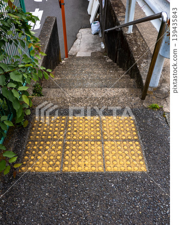 Example of installing tactile paving blocks in front of stairs outdoors Example of installing tactile paving blocks in front of stairs outdoors 139435843