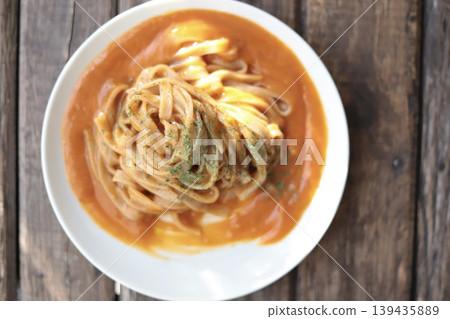 Crab and tomato cream pasta made with flat brown rice noodles (gluten-free noodles) Crab and tomato cream pasta made with flat brown rice noodles (gluten-free noodles) 139435889