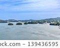A distant view of Toba City, with the three islands floating in Toba Bay and the resort hotel district of Toba City. 139436595