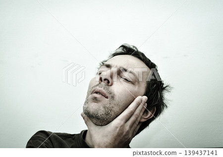 Young man suffering from toothache pain 139437141