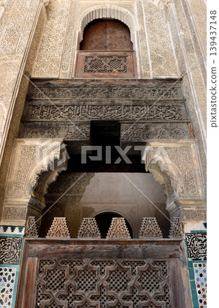 Carved stone gate arch, carved wooden architectural details, Medersa bou Inania, Fez, Morocco 139437148