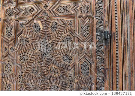 Carved wooden door details with geometric patterns, Bou Inania Madrasa. Fez, Morocco 139437151