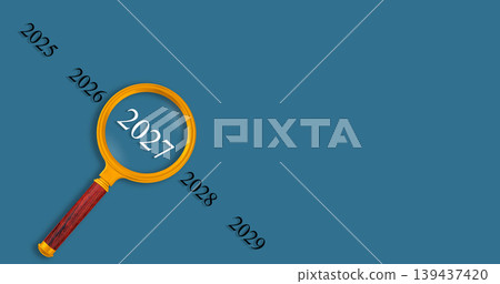 Vision 2027 concept with magnifying glass on blue background, looking into the future 139437420