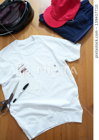 Adding names to elementary school gym clothes 139437710