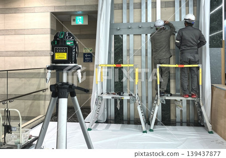 Use a laser level to measure vertical and horizontal lines. Use a laser level to measure vertical and horizontal lines. 139437877