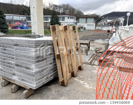 An outdoor construction or renovation site on an overcast day. Concept for the construction and renovation of a hotel before the summer season An outdoor construction or renovation site on an overcast day. Concept for the construction and renovation of a hotel before the summer season 139438069