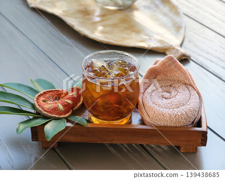 Bael fruit juice serving with cold towel Bael fruit juice serving with cold towel 139438685