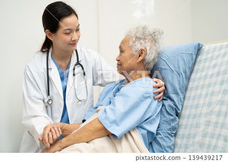 Asian doctor checking and treat elderly woman patient health in hospital. Asian doctor checking and treat elderly woman patient health in hospital. 139439217