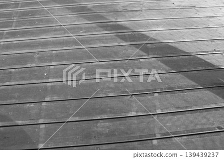 Outdoor Wooden Deck Boards with Natural Patterns and Shadows Outdoor Wooden Deck Boards with Natural Patterns and Shadows 139439237