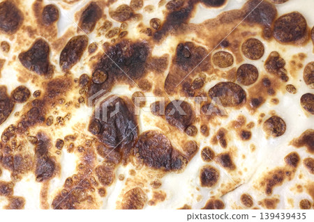 Close-Up of Golden-Brown Bread Crust Texture for Culinary Design Close-Up of Golden-Brown Bread Crust Texture for Culinary Design 139439435