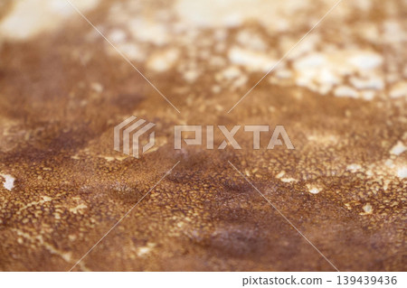 Close-Up of Golden Brown Crepe Texture for Culinary Design and Food Art 139439436