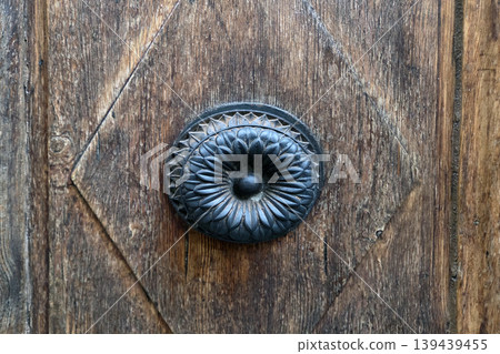Vintage Ornate Doorknob on Rustic Wooden Door Architectural Detail for Interior Design Vintage Ornate Doorknob on Rustic Wooden Door Architectural Detail for Interior Design 139439455