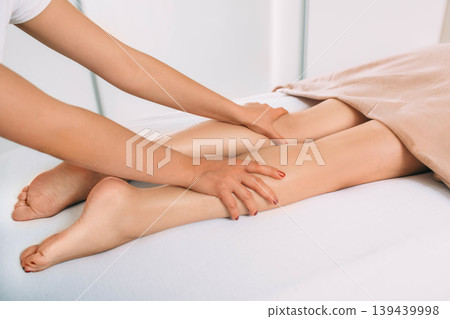 anti cellulite leg and foot massage. massage for slim leg and body anti cellulite leg and foot massage. massage for slim leg and body 139439998
