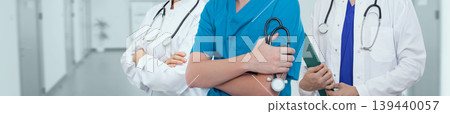 Team of doctors standing in the hospital corridor. Medical support and care concept 139440057