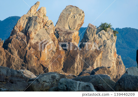 The magnificent scenery of Hashigui-iwa, a group of gigantic, strangely shaped rocks lining the coastline. The magnificent scenery of Hashigui-iwa, a group of gigantic, strangely shaped rocks lining the coastline. 139440209